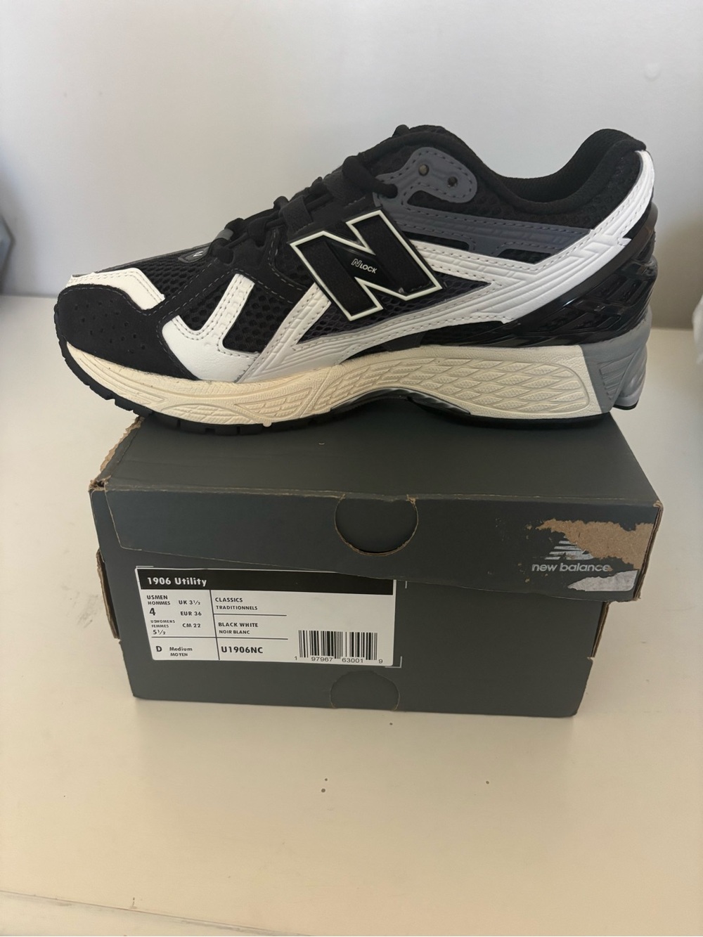 New Balance women’s Black and White 1906 Utility Sneaker